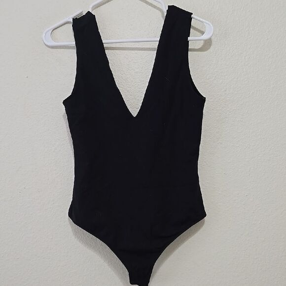 Free People Black Bodysuit with Deep V-Neck and High-Cut Design - Picture 1 of 5